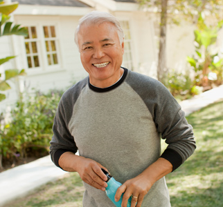 Older man outdoors with water bottle